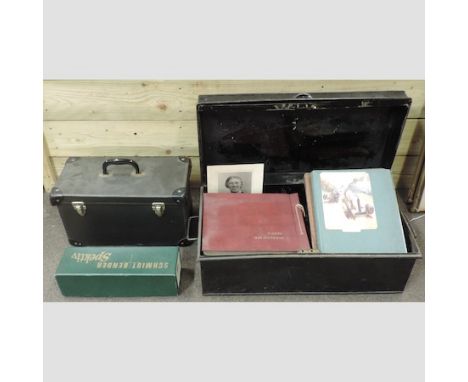 A World War II tin trunk containing various photograph albums and scrapbooks, together with a vintage Aldis projector, cased 