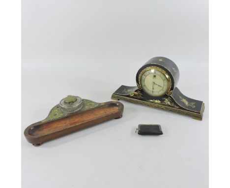 An early 20th century Smiths ebonised mantel clock, 15.5cm tall, together with a desk stand and a sovereign case
