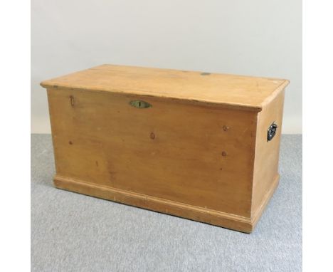 A Victorian pine trunk, 115cm, containing a candle box