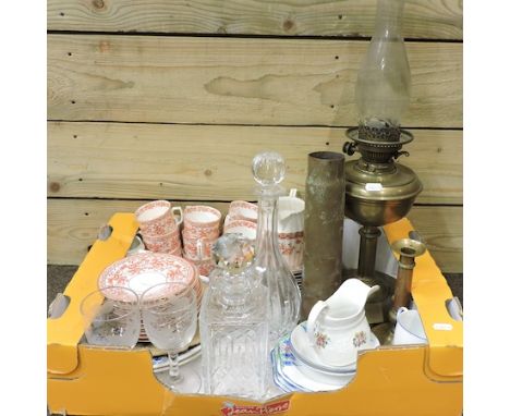 A box of items to include teawares, decanters and an oil lamp