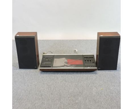 A vintage Bang and Olufsen Beocenter 2000, type 2101 music centre, together with a pair of Beovox S-35 speakers