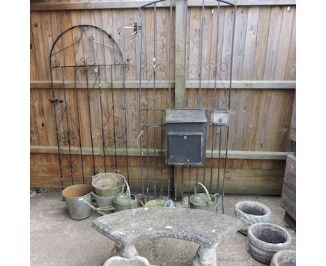 A black painted wrought iron garden gate, 200cm tall, together with another smaller, a stone bench, galvanised buckets and re