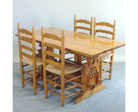 A pine kitchen table, 150 x 74cm, together with four ladder back dining chairs 