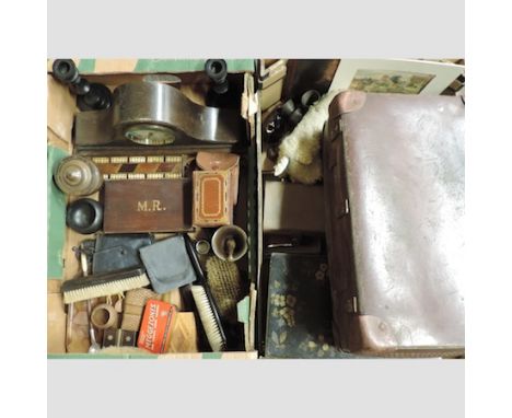 Two boxes of items, to include a mantel clock, candlesticks, a small suitcase and pewter plates