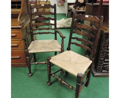 A set of eight rush seated ladder back dining chairs, to include two carvers 