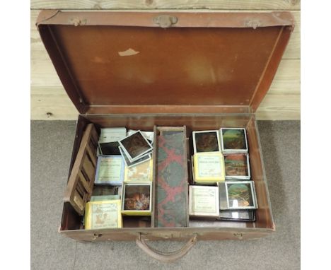 A vintage case containing magic lantern slides 