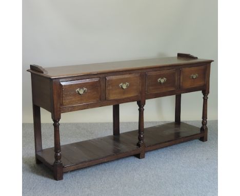 An 18th century style oak dresser base, with a pot shelf beneath, 175cm