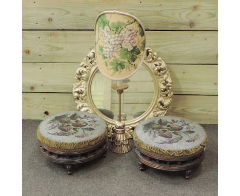 A pair of 19th century beadwork footstools, 29cm diameter, together with a gilt painted wall mirror and a table lamp