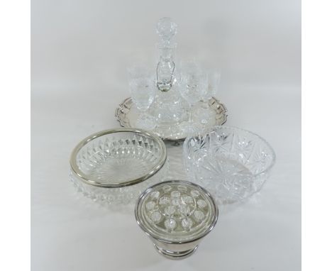 A collection of cut glass wine glasses, together with a decanter, cut glass bowls, a silver plated rose bowl and tray, with i
