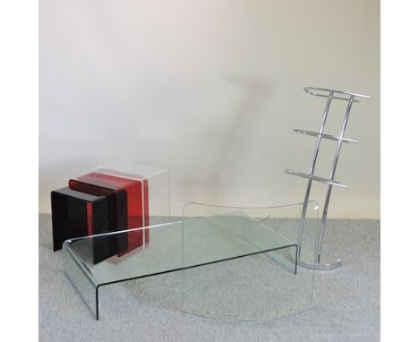 A nest of three coloured perspex occasional tables, together with a chrome clothes horse, a glass firescreen and a glass coff