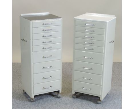 A pair of mid 20th century vintage metal dentists cabinets, each 40cm, together with a gas mask