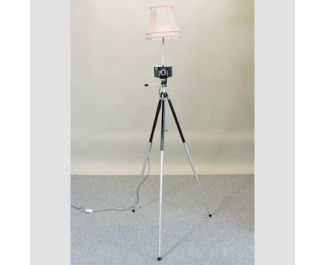 A tripod and camera standard lamp 