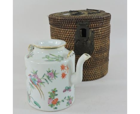 A 19th century Cantonese teapot, 14cm tall, in a wicker carrying box 