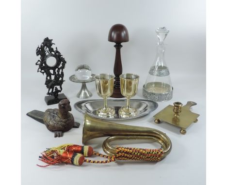 A collection of items to include a brass military bugle, wig stand, decanter, watch stand and metal wares