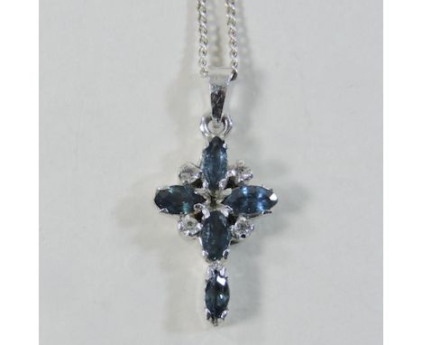 An unmarked sapphire and diamond cross pendant, on chain 