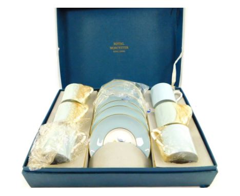 A Royal Worcester porcelain coffee set decorated in the Woodland pattern, comprising six demi-tasse coffee cans and saucers, 