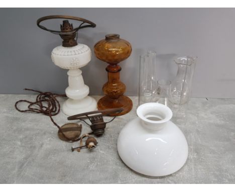 Box containing milk glass oil lamp with shade plus amber glass, glass chimneys and hanging light fitting