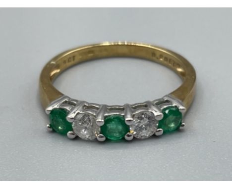 Ladies 18ct gold Emerald and Diamond ring. Featuring 3 round emeralds and 2 diamonds. 1.65g size K