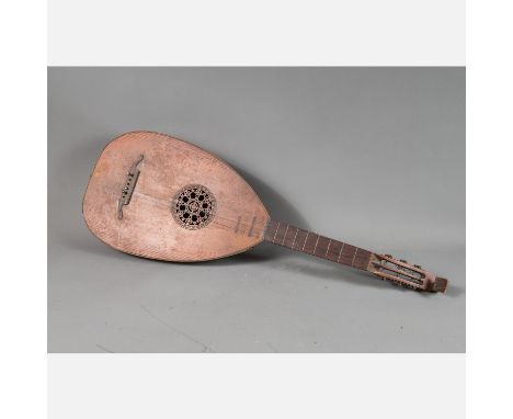 Lute, pear shaped body with canted back, long neck, four six cords, central open work sound hole, partly carved, damages, 19t