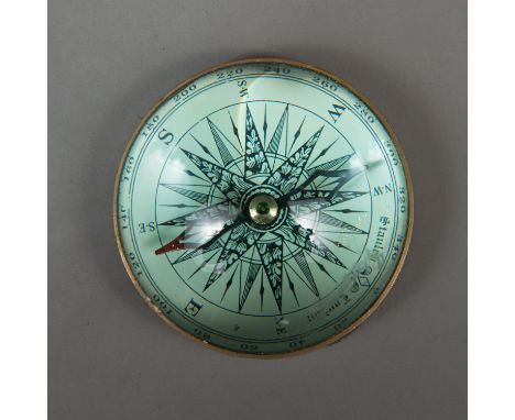 Stanley Compass, in round glass, bronze mantle. 9 cm diameter.