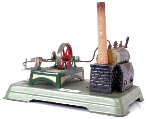 FLEISCHMANN LIVE STEAM; A vintage original Fleischmann live steam plant, on green metal base with flywheel and boiler. Fleisc