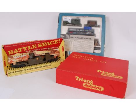 TRAINS; A collection of railway train set items, comprising of; a Playcraft vintage HO Gauge International Clockwork boxed tr