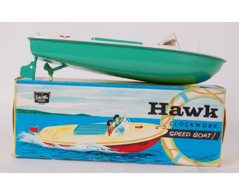 SUTCLIFFE; An original vintage Sutcliffe Hawk tinplate clockwork boat, within the original box. This boat has 'never touched 