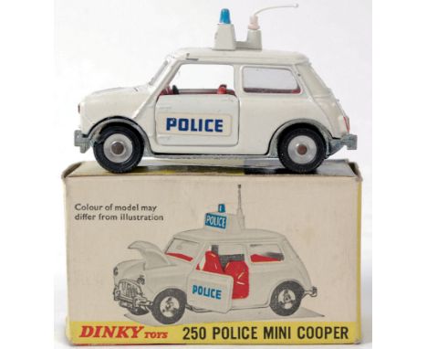 DINKY; An original vintage Dinky Toys diecast model 250 Police Mini Cooper, within original cardboard box. Opening doors and 