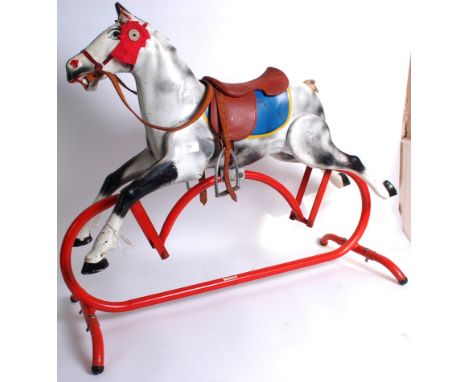 TRIANG: An original vintage Triang tinplate tubular metal rocking horse. On a moving stand (with Triang label to centre). Hor
