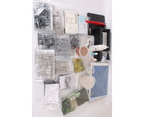 MODEL KITS; A good selection of assorted vehicle related model kits / part kits / Code 3 diecast customising kits, each withi