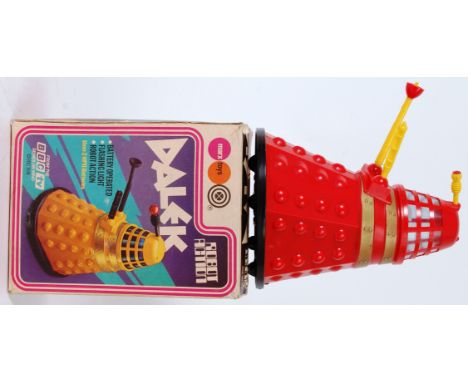DOCTOR WHO DALEK; An original and rare 1974 Marx Toys battery operated Doctor Who Dalek toy, in red plastic with gold banding