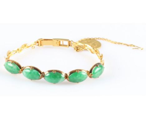 A five stone jadeite jade bracelet, set with five oval jadeite cabochons on articulated links to an overlapping oval link bra