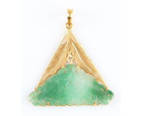 A carved jadeite jade pendant, featuring double fish design to a triangular open metalwork pendant mount, unmarked yellow met