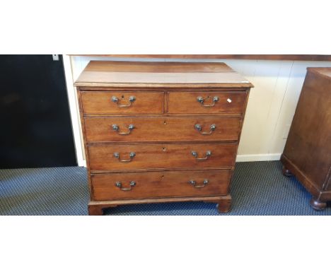 An oak three long and two short drawers chest on bracket feet. IMPORTANT: Online viewing and bidding only. No in person colle