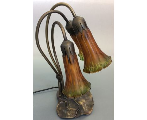 A modern art nouveau style table light with three glass shades, 40cm. IMPORTANT: Online viewing and bidding only. No in perso