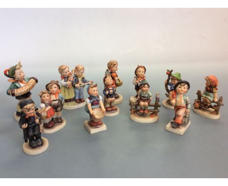 Twelve Goebel Hummel figures, one AF. IMPORTANT: Online viewing and bidding only. No in person collections, Mail Boxes Etc co