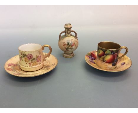 Three pieces of Royal Worcester to include two cups and saucer and one small vase. IMPORTANT: Online viewing and bidding only
