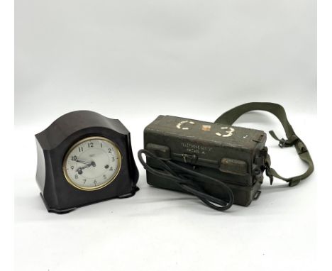 A vintage Army field telephone "Set J - YA7815" with broad arrow mark along with a vintage Smiths of Enfield bakelite mantle 