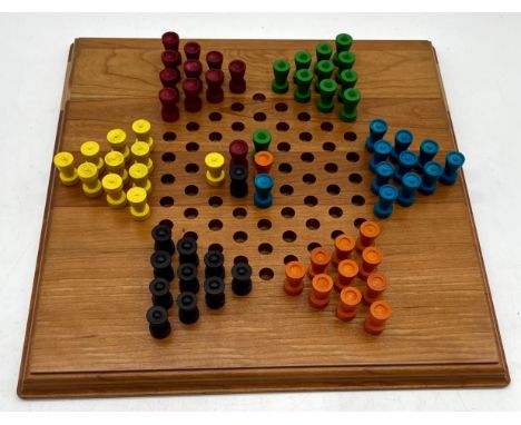 A Solitaire/Chinese Checkers wooden board game.