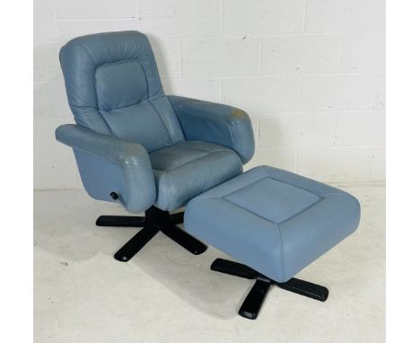 A mid-century G-Plan leather swivel arm chair in light blue with matching stool