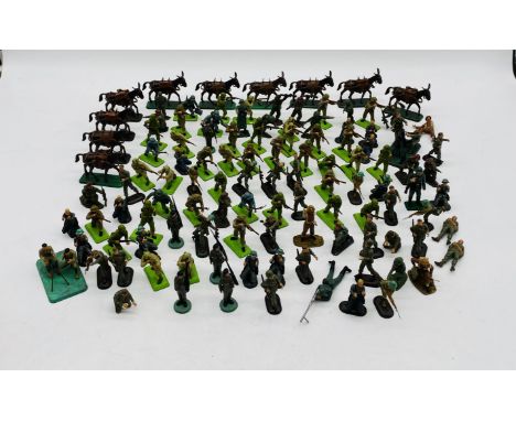 A collection of plastic military army soldiers toy figurines (some with metal bases) including Britains Deetail etc