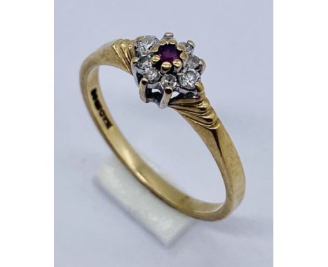 A 9ct gold ruby and diamond cluster ring