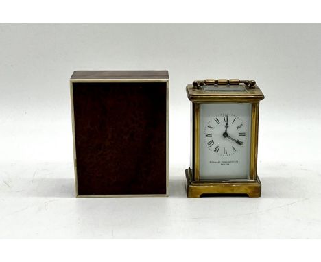 A carriage clock by Stewart Dawson & co Ltd of London with key 8cm x 6.5cm, height 14cm. Lot also contains a small wooden box