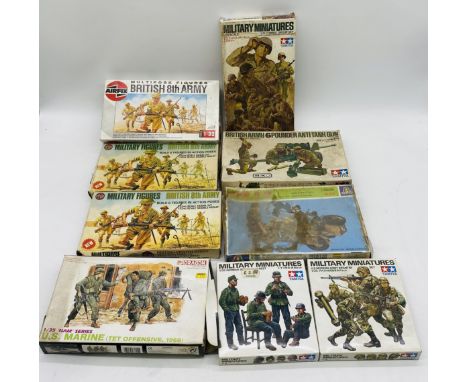 A collection of nine boxed military miniatures plastic model sets including four by Tamiya (German Soldiers at Rest, U.S Mode