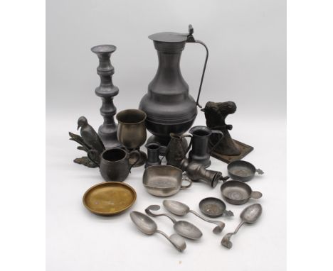 A quantity of antique and later pewter, including a large jug, candlestick, four spoons etc 