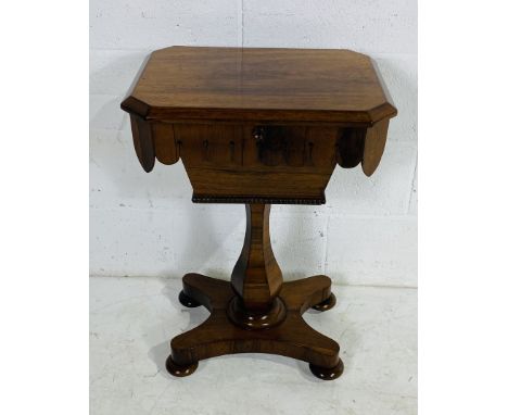 A rosewood sewing table on hexagonal pillar support - height 75cm, width 52cm