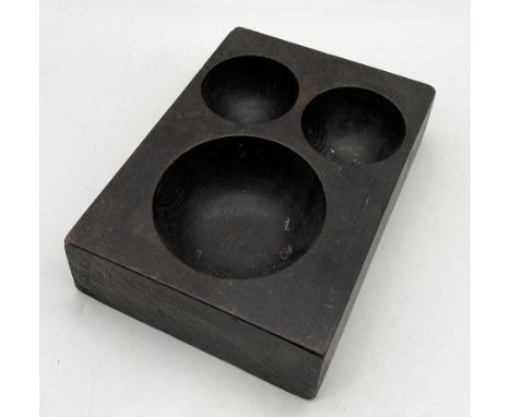 A vintage wooden cash tray with three wells