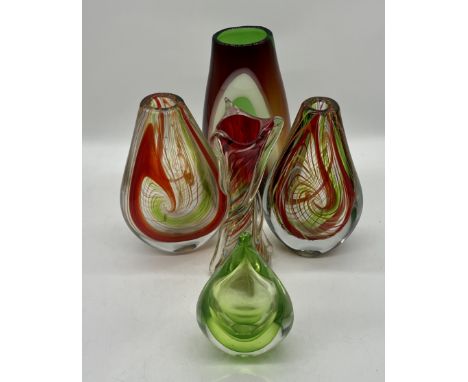 A collection of four art glass vases plus a teardrop sculpture. 