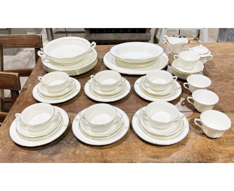 A Royal Worcester "Strathmore" pattern part dinner service comprising of dinner plates, soup bowls, sugar bowl, jug , cups, s