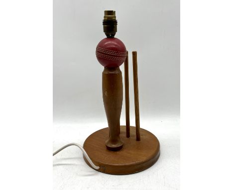 A cricket themed lamp, height 35cm